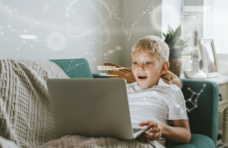 Boy with laptop using AI