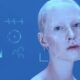 A woman's face getting scanned with AI tool
