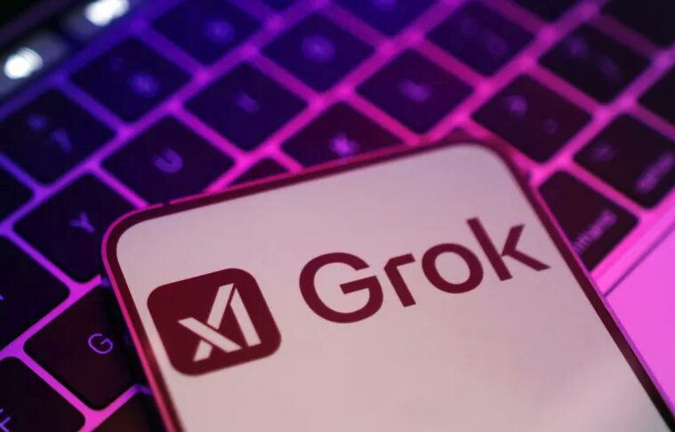 A keyboard and a smartphone with Grok logo