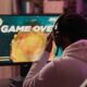 A man playing video games on computer.