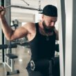 A young man lifting weights at the gym
