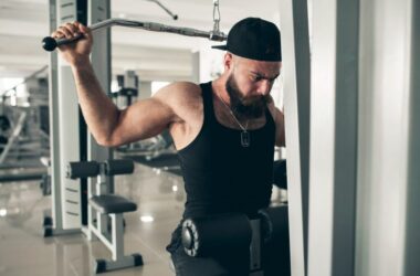 A young man lifting weights at the gym