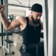 A young man lifting weights at the gym