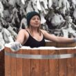Woman doing a cold plunge in an ice bath