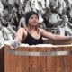 Woman doing a cold plunge in an ice bath