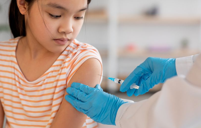 A girl getting vaccinated.