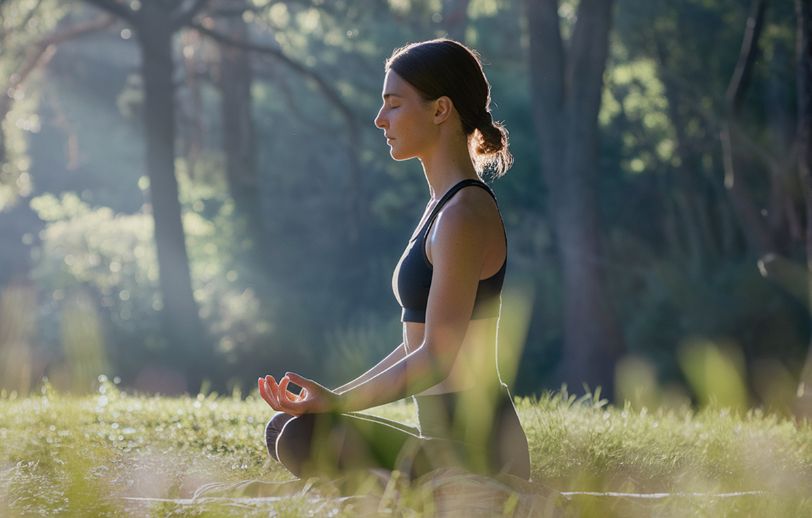Woman meditating in nature.